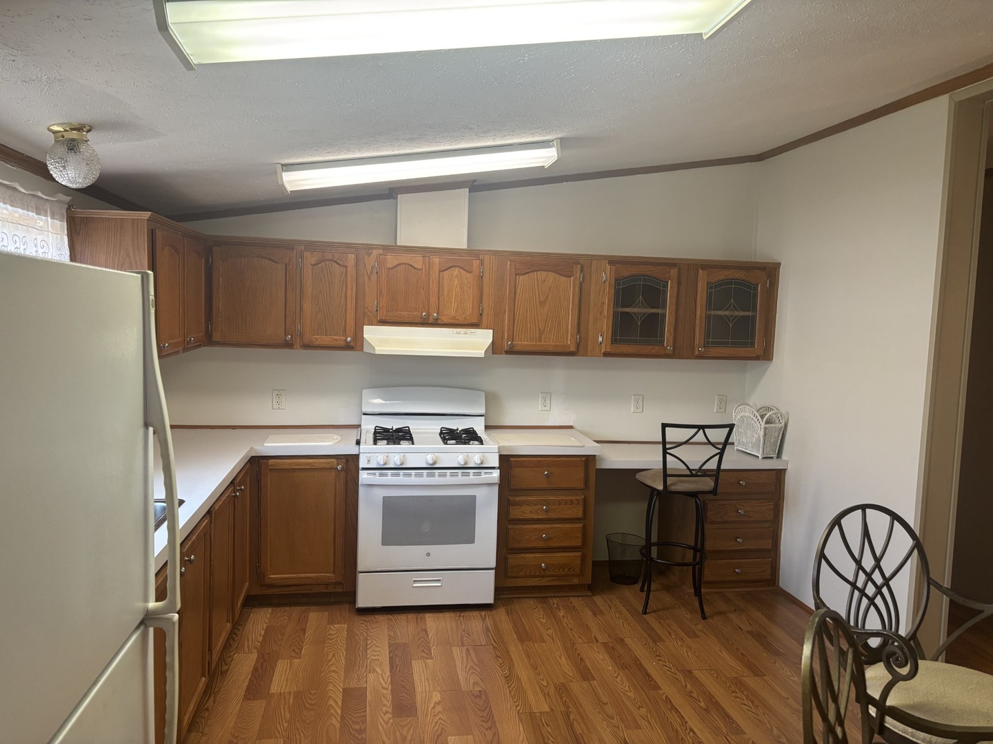 85 Partridge Lane Beecher, IL 60401 - Photo 5 of 11 a kitchen with stainless steel appliances a stove a sink and a microwave