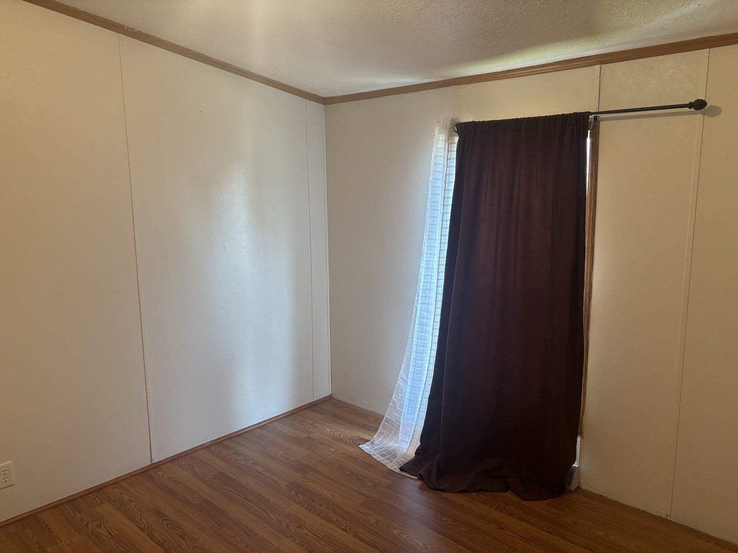 85 Partridge Lane Beecher, IL 60401 - Photo 7 of 11 a view of an empty room with wooden floor