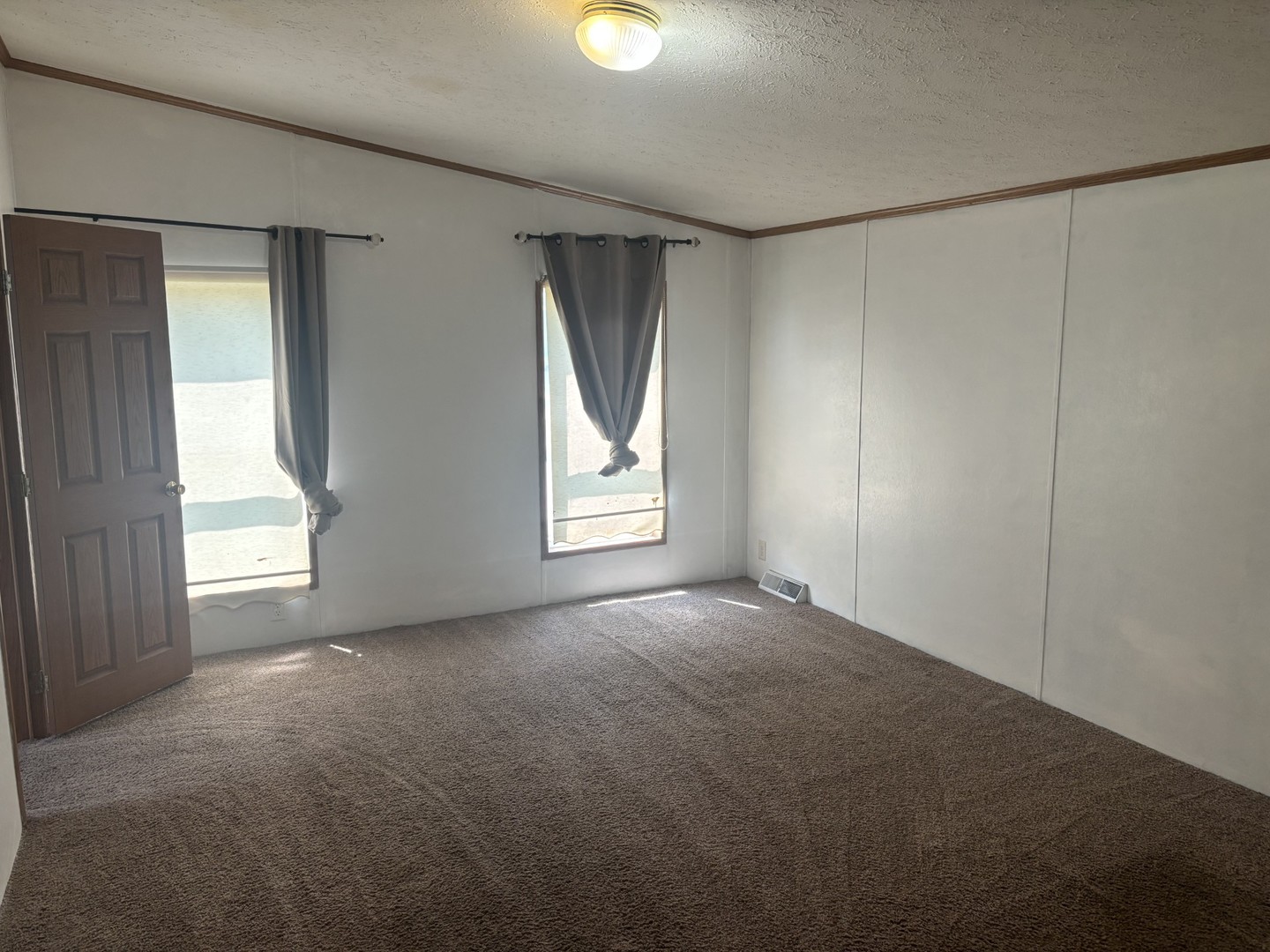 85 Partridge Lane Beecher, IL 60401 - Photo 9 of 11 an empty room with windows and closet