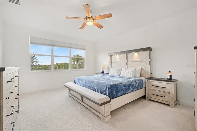 a bedroom with bed and window