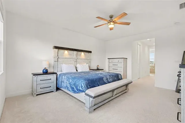 a bedroom with a bed and window