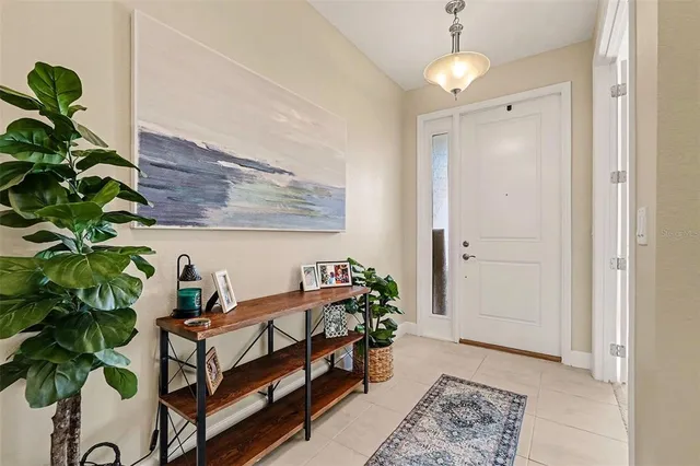 a bedroom with furniture and a potted plant
