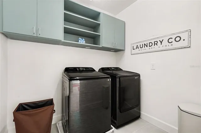 a view of a chair and tables in the patio in front of a house