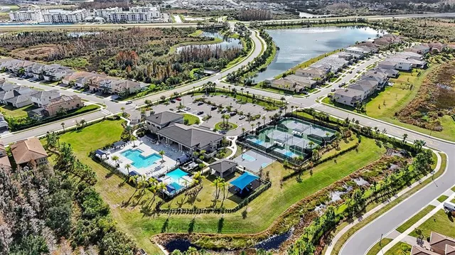an aerial view of a house with a yard