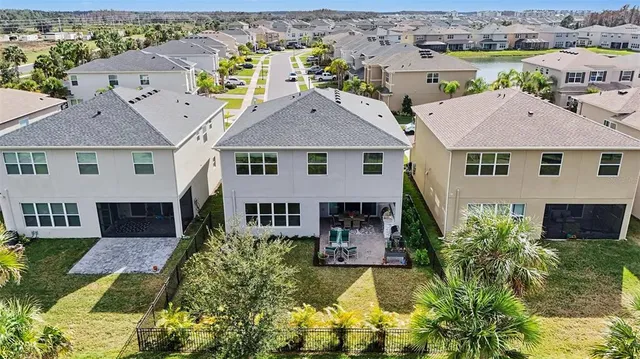 a view of a lake with a table and chairs