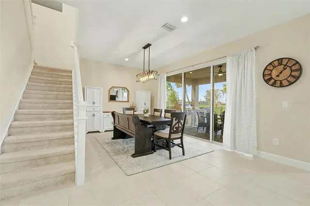 a view of a dining room with furniture window and outside view