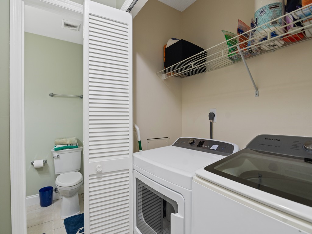 2020 Vero S Circle Southwest, Unit 4 Vero Beach, FL 32962 - Photo 16 of 28 a utility room with dryer and washer