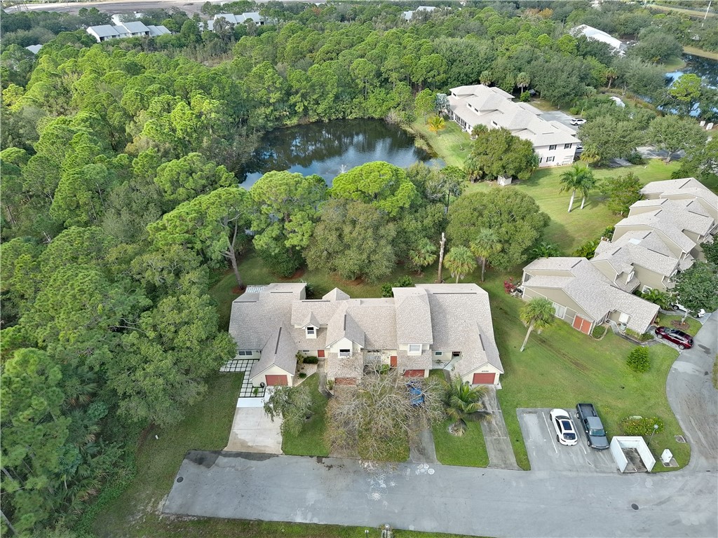 2020 Vero S Circle Southwest, Unit 4 Vero Beach, FL 32962 - Photo 19 of 28 an aerial view of a house with yard and outdoor seating