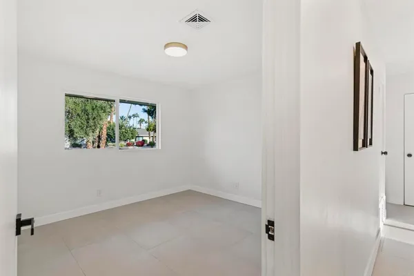 an empty room with windows
