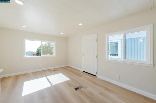 an empty room with windows