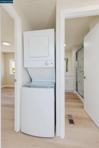a view of hallway with wooden floor