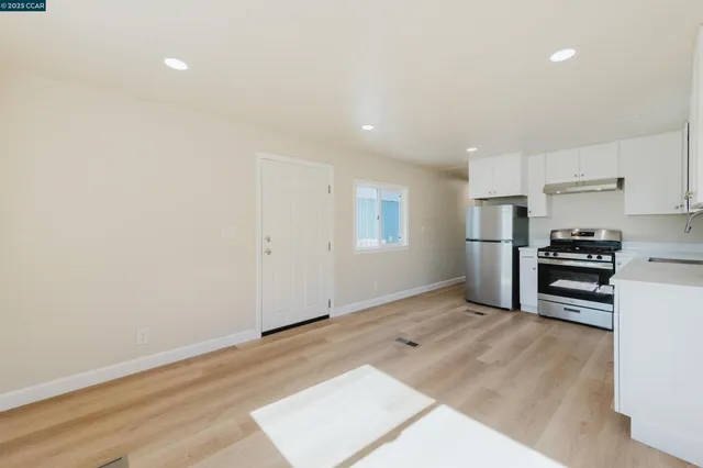 a view of kitchen with wooden floor