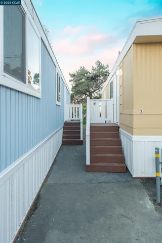 a view of stairs and hall with wooden floor