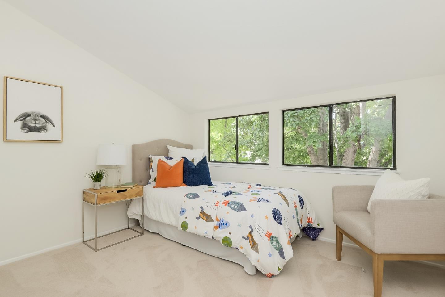 725 Rainbow Drive Mountain View, CA 94041 - Photo 13 of 23 a bedroom with a bed and a large window