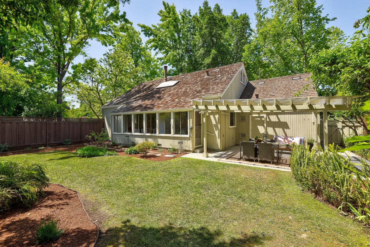 725 Rainbow Drive Mountain View, CA 94041 - Photo 19 of 23 a view of a house with backyard and sitting area