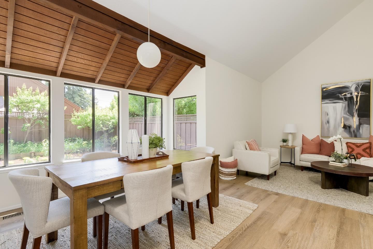 725 Rainbow Drive Mountain View, CA 94041 - Photo 4 of 23 a view of a dining room with furniture wooden floor and chandelier