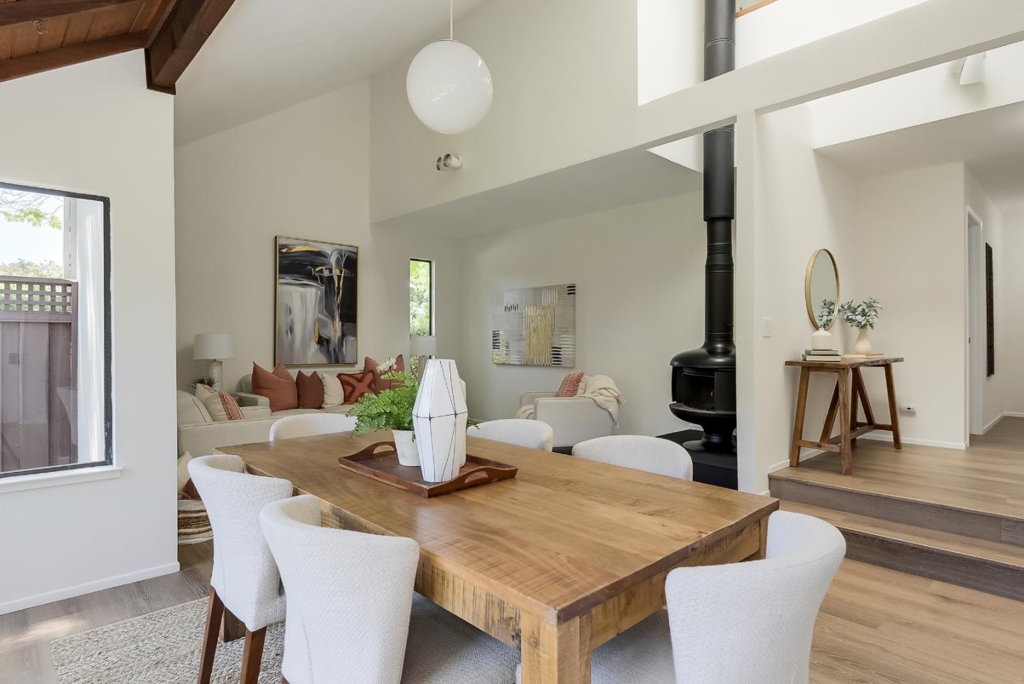 725 Rainbow Drive Mountain View, CA 94041 - Photo 7 of 23 a dining room with wooden floor a glass table and chairs