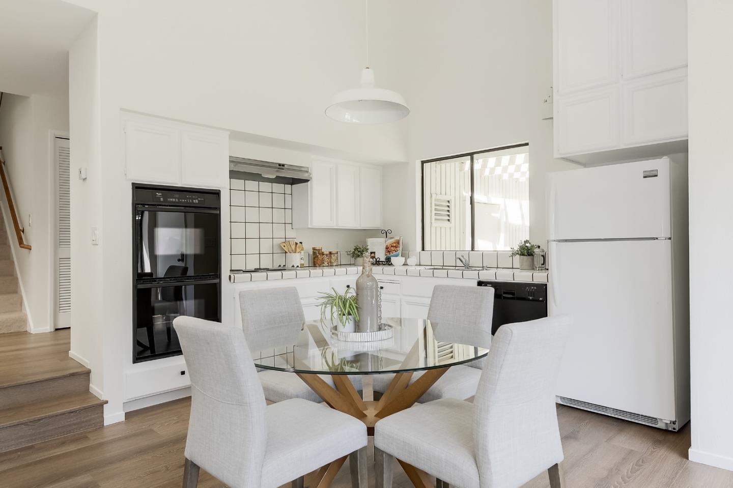 725 Rainbow Drive Mountain View, CA 94041 - Photo 8 of 23 a view of a dining room with furniture and wooden floor