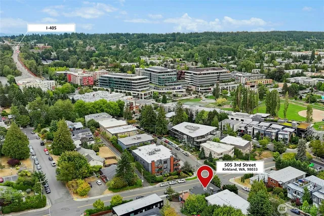 a kitchen with a sink and a stove top oven