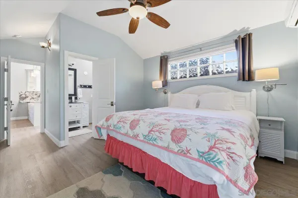 a bedroom with a bed and a view of bathroom