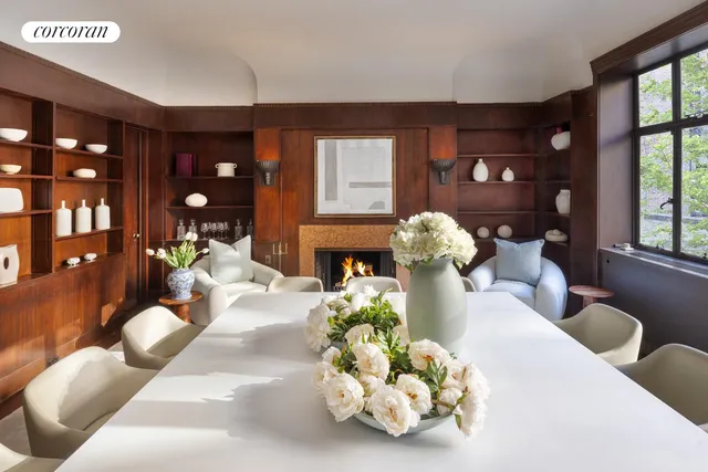 a dining room with furniture and wooden floor