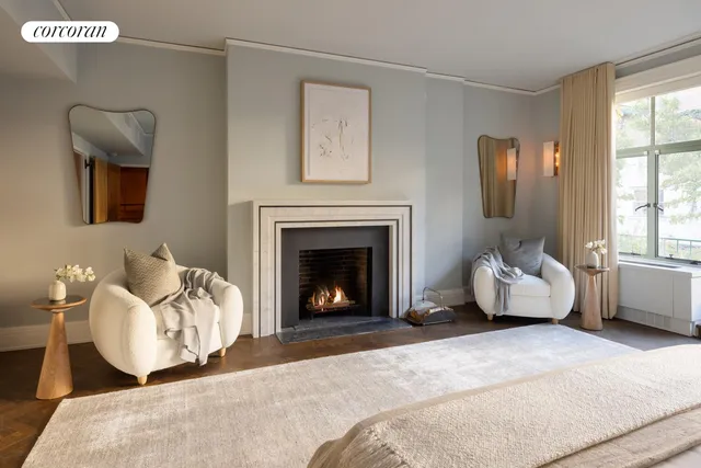 a large bedroom with a bed wooden floor and window