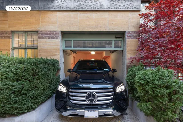 a view of a patio with couches table and chairs under an umbrella