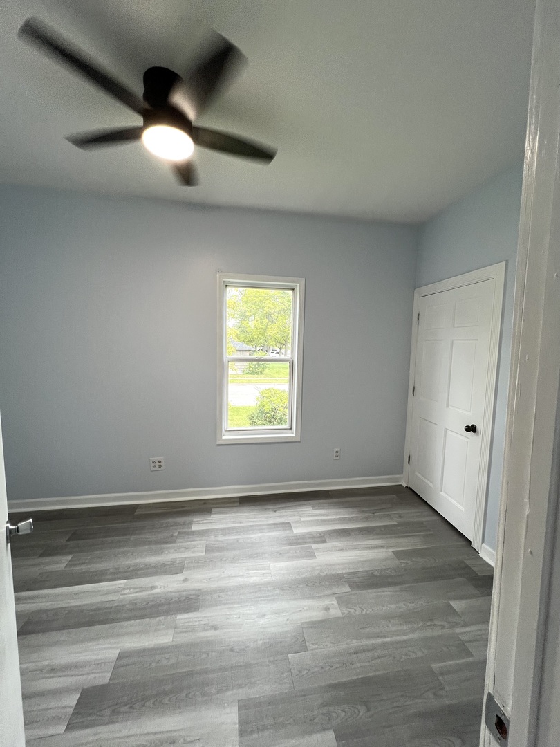 3002 Green Street, Unit 1 Steger, IL 60475 - Photo 17 of 29 an empty room with a empty space and windows