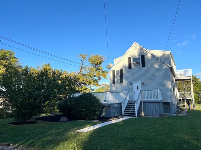 a front view of house with a garden