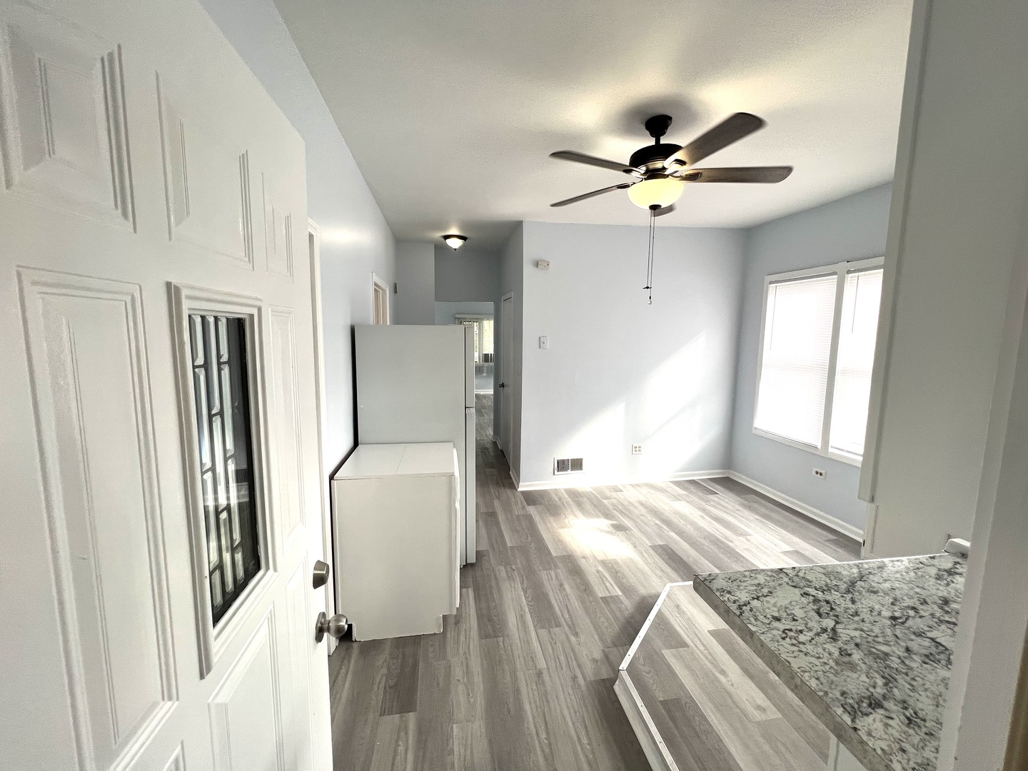 3002 Green Street, Unit 1 Steger, IL 60475 - Photo 6 of 29 a living room with furniture and a chandelier
