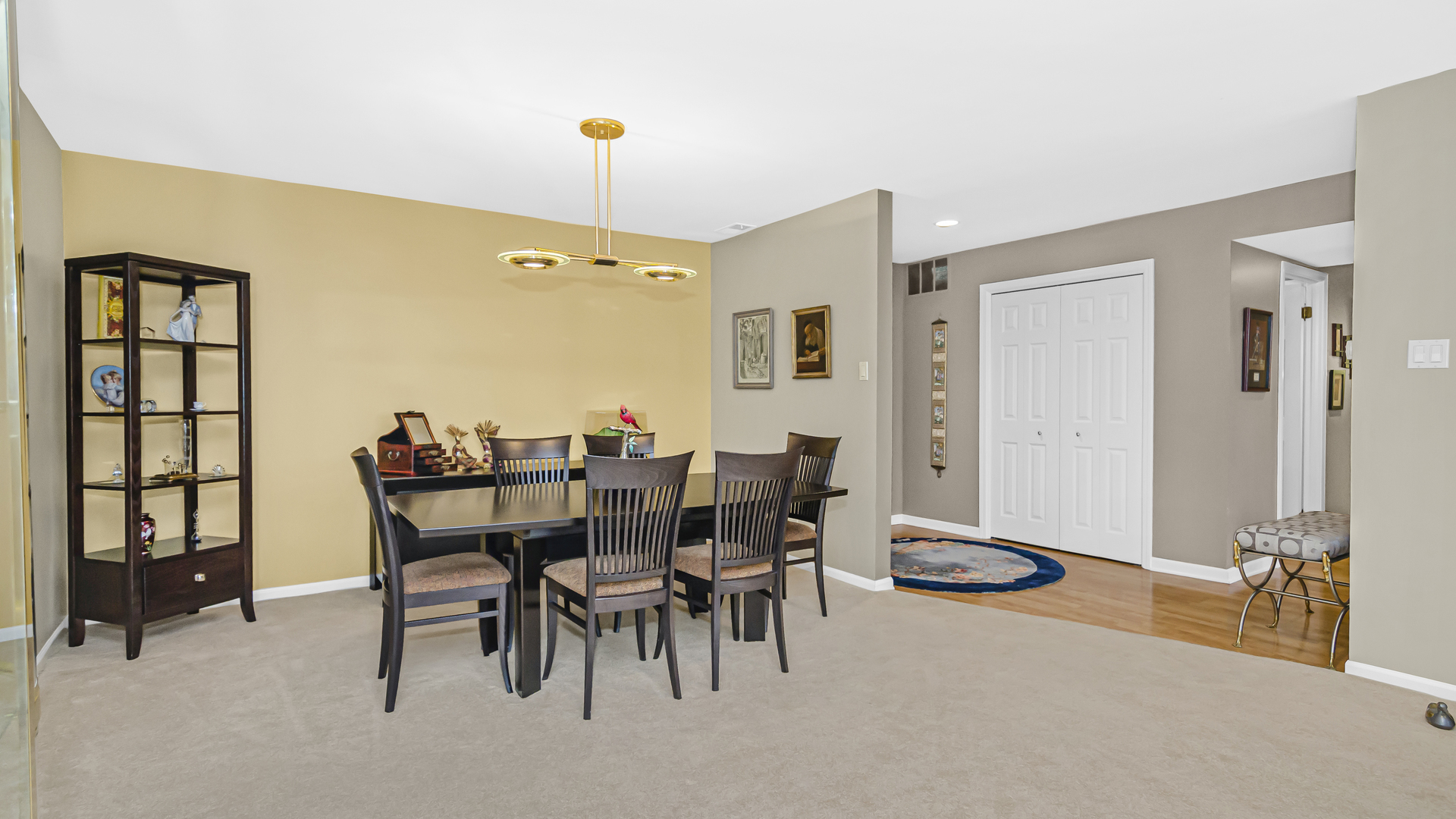 1125 Lake Cook Road, Unit 504E Northbrook, IL 60062 - Photo 7 of 21 a view of a dining room with furniture and a chandelier