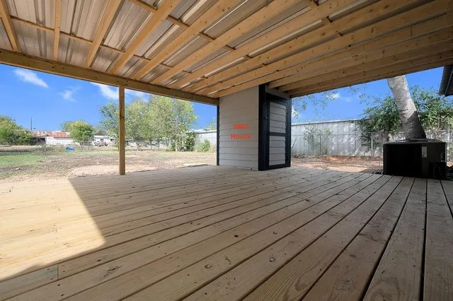 a porch with wooden floor and outdoor space