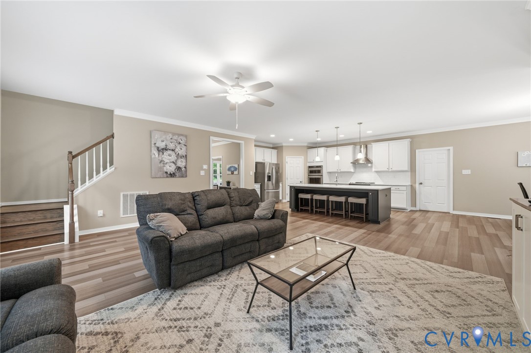 7598 Rural Point Road Mechanicsville, VA 23116 - Photo 7 of 41 a living room with furniture and kitchen view