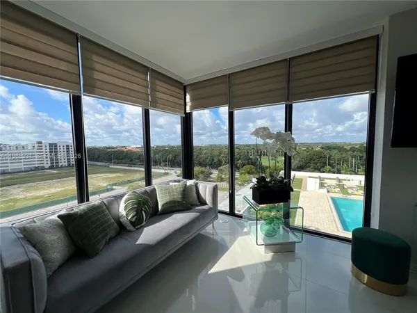 a kitchen with stainless steel appliances granite countertop a sink a stove a refrigerator and a refrigerator