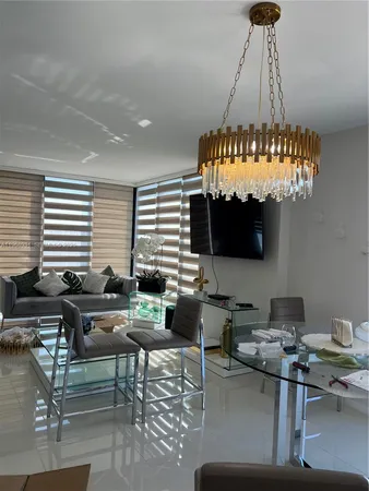 a couple of palm trees in front of house