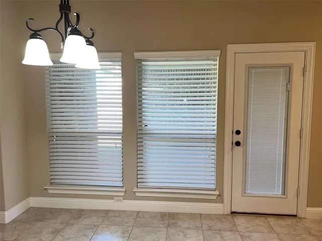 a view of a kitchen with a counter top space stainless steel appliances and cabinets