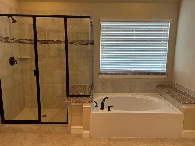 a large bathroom with a sink and a large mirror
