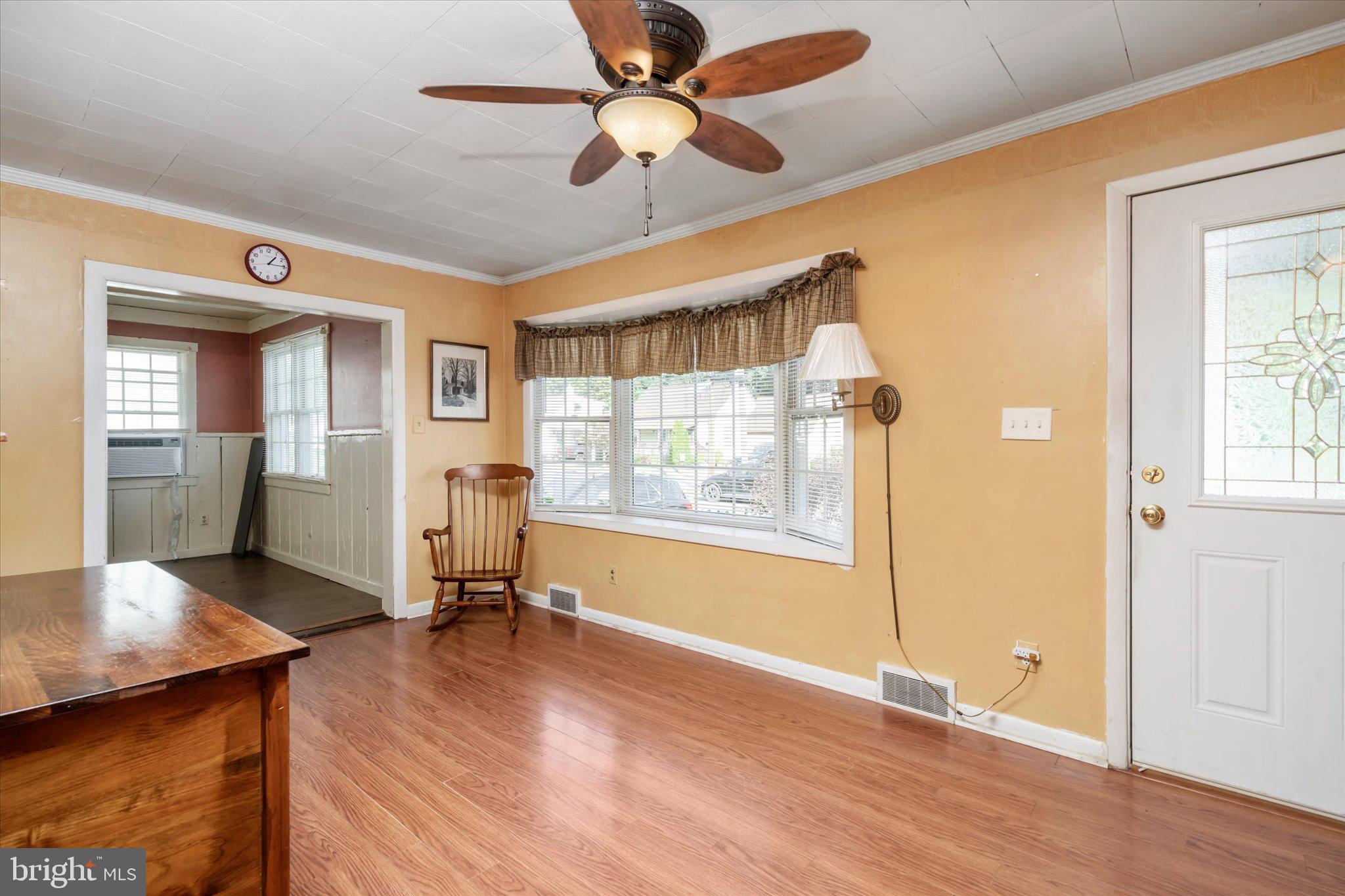 41 Collins Road Hamilton, NJ 08619 - Photo 5 of 23 a view of a livingroom with wooden floor and a ceiling fan