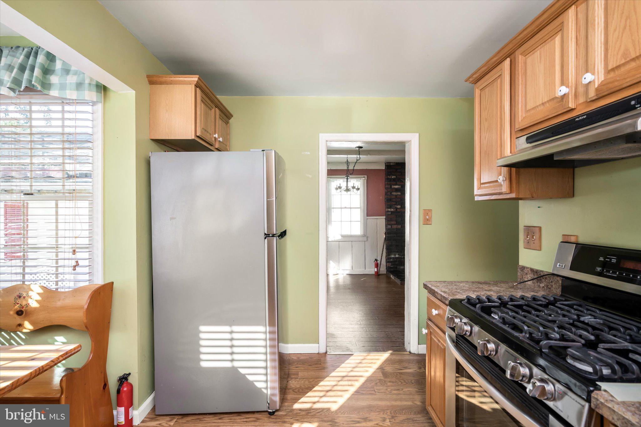 41 Collins Road Hamilton, NJ 08619 - Photo 10 of 23 a kitchen with stainless steel appliances granite countertop a refrigerator and a stove