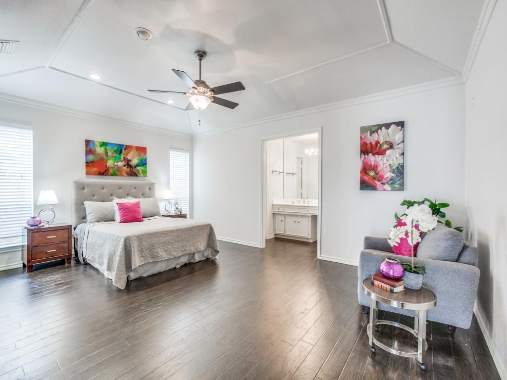 10620 Sandpiper Lane Dallas, TX 75230 - Photo 5 of 12 a bedroom with a bed and a chandelier