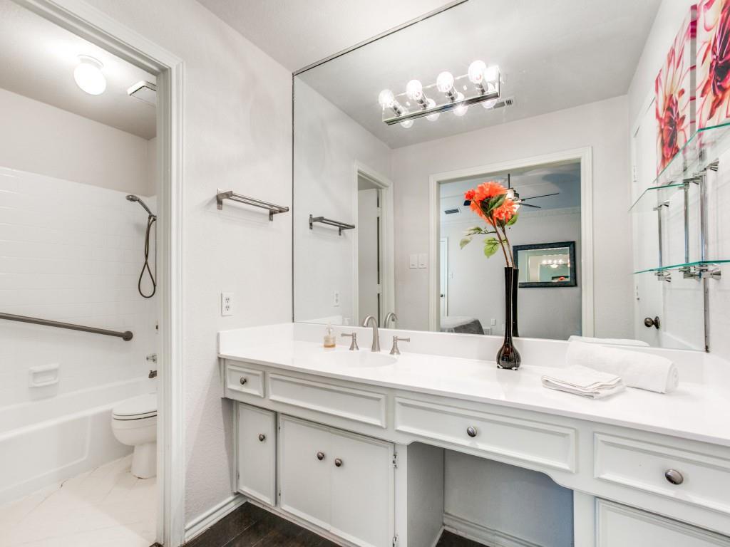 10620 Sandpiper Lane Dallas, TX 75230 - Photo 6 of 12 a bathroom with a granite countertop sink mirror vanity and toilet