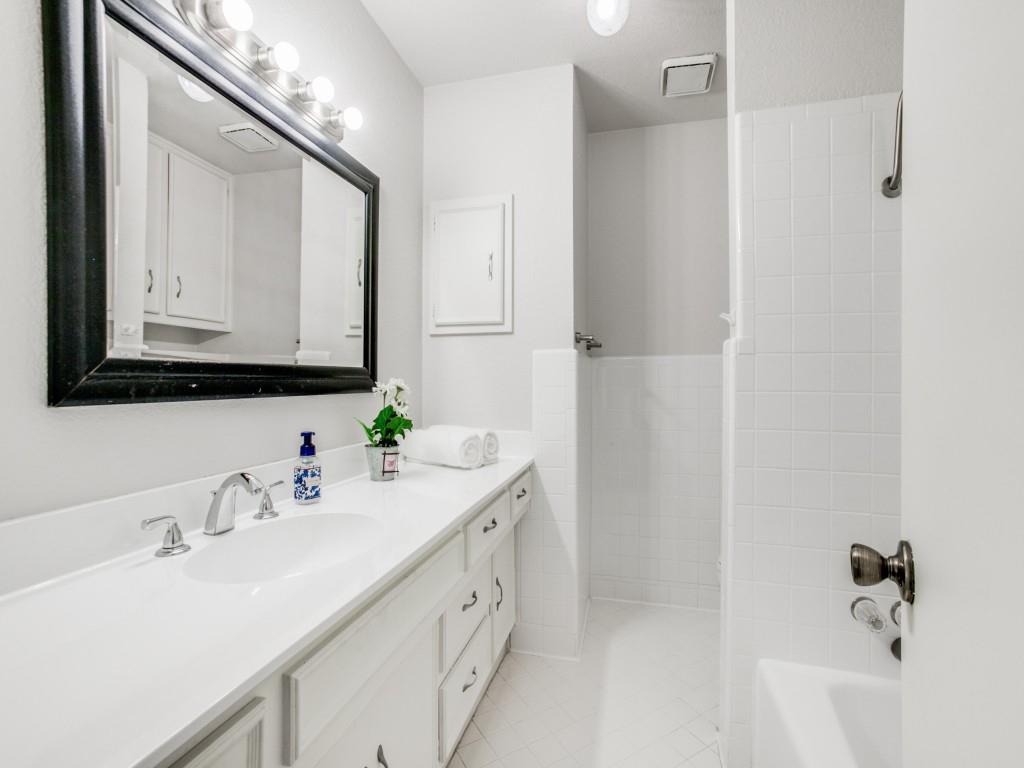 10620 Sandpiper Lane Dallas, TX 75230 - Photo 9 of 12 a bathroom with a double vanity sink mirror and