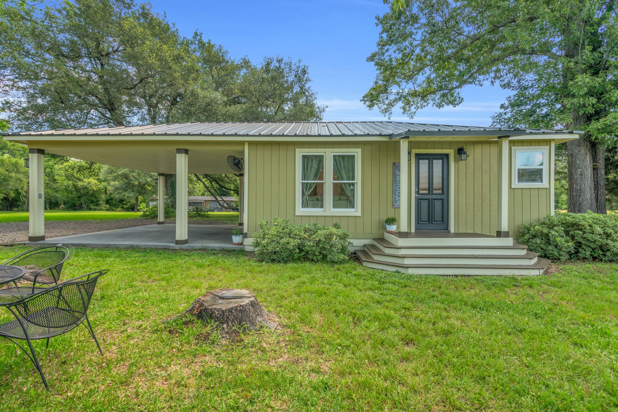 17821 Brown Road Conroe, TX 77306 - Photo 41 of 50 a front view of a house with garden