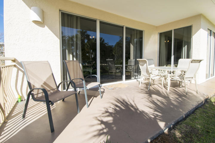 10254 East Co Highway, Unit 135 Inlet Beach, FL 32461 - Photo 2 of 10 a living room with patio furniture and floor to ceiling window