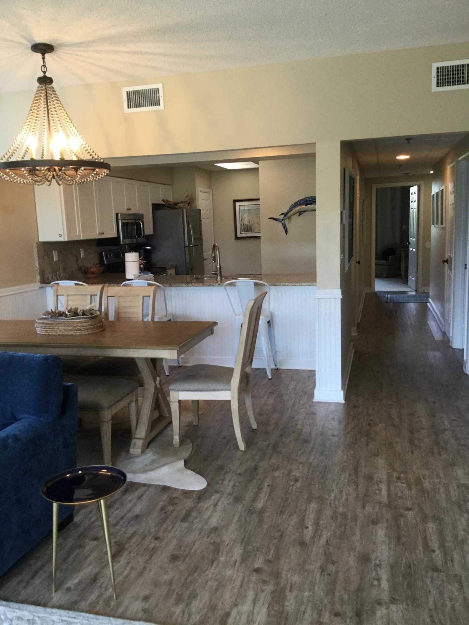 10254 East Co Highway, Unit 135 Inlet Beach, FL 32461 - Photo 9 of 10 a dining room with furniture and a table