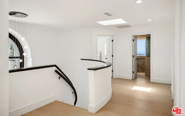 a view of a hallway with staircase