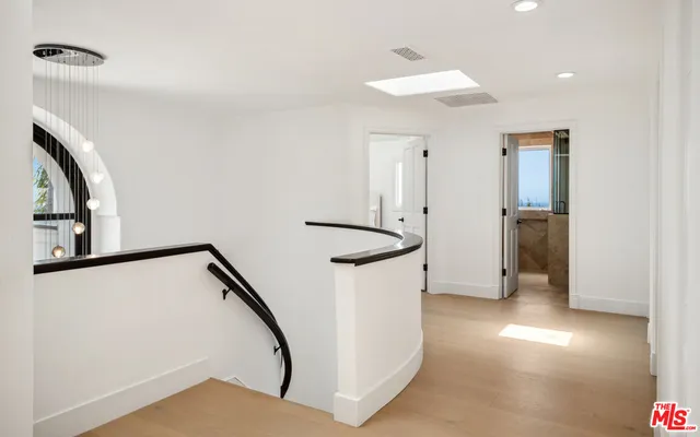 a view of a hallway with staircase