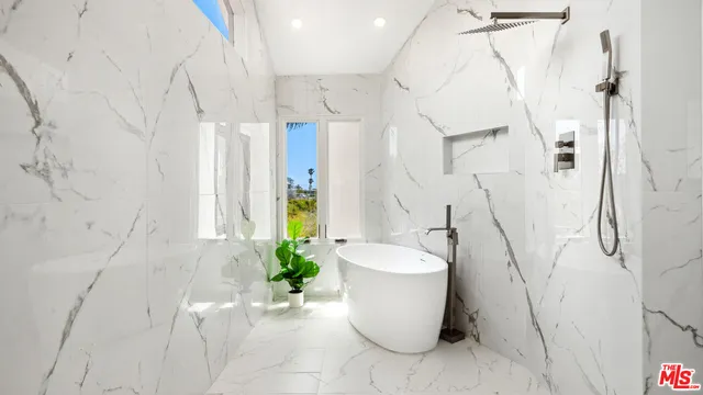 a white bath tub sitting in a bathroom