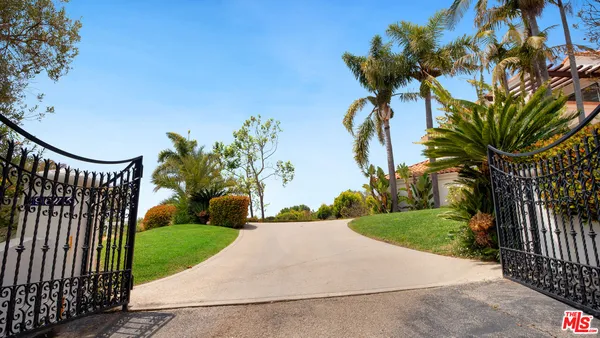 a view of a garden with a pathway