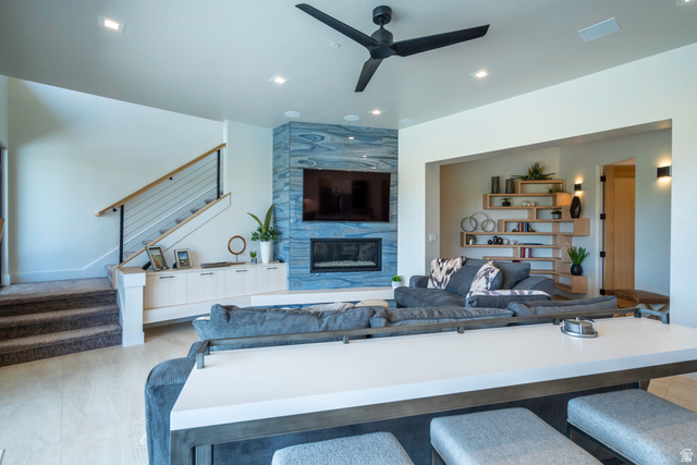 3606 South Cypress Road Hurricane, UT 84737 - Photo 58 of 69 Living area featuring ceiling fan, a high end fireplace, and recessed lighting